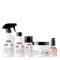Linha de produtos de cuidados capilares da marca L'Oréal Professionnel, chamada Metal Detox. Os produtos incluem um pré-tratamento, um shampoo, um creme de alta proteção, um sérum e uma máscara. Todas as embalagens exibem o nome "Metal Detox".