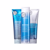 A imagem mostra três produtos da marca Joico: shampoo, condicionador e máscara Moisture Recovery. As embalagens são na cor azul com detalhes em branco e cinza prateado.