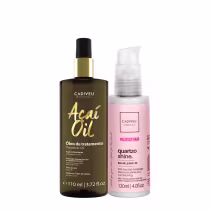 Óleo de tratamento Acai Oil da Cadiveu Professional em frasco escuro com rótulo dourado, acompanhado de um balm leave-in Quarzo Shine da linha Essentials da Cadiveu em embalagem rosa.