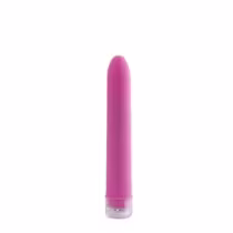 Vibrador rosa de formato cilíndrico, com superfície lisa e acabamento fosco. Possui base plana e tampa removível. Embalagem e rótulo não visíveis na imagem.