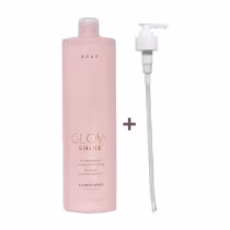 Condicionador Glow Shine da marca Brae. Embalagem plástica rosa claro com bomba dosadora branca. Rótulo com o nome do produto "Glow Shine" e descrição em letras douradas. Frasco de 1L. Design minimalista e elegante.