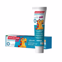 A imagem mostra gel dental infantil e caixa do produto. Apresentam um personagem infantil amarelo com detalhes em vermelho, semelhante a um dinossauro, com uma expressão sorridente.