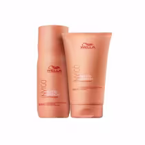 Shampoo 250ml e condicionador 200ml. Estão lado a lado, cor das embalagens é laranja.