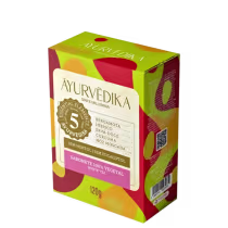 Sabonete 100% vegetal da marca Ayurvedika. A embalagem é uma caixa retangular de cor verde e rosa, com informações sobre os ingredientes do produto, como bergamota, hibisco, erva-doce, cúrcuma e noz-moscada.