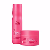 Um shampoo e um tratamento capilar da linha Invigo Color Brilliance. Embalagens cilíndricas de plástico na cor rosa vibrante. O shampoo tem um frasco de 250ml e o tratamento vem em um pote de 150ml.