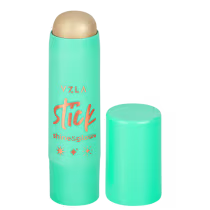 Bastão iluminador compacto da marca Vizzela Cosméticos, com embalagem em tom de verde menta e detalhes em laranja. O produto é descrito como "Shine & Glow" no rótulo.