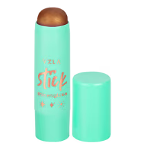 Bastão de iluminador da marca Vizzela, em embalagem cilíndrica de cor verde-menta com detalhes em laranja, exibindo o nome "Stick" e efeitos de "shine & glow".