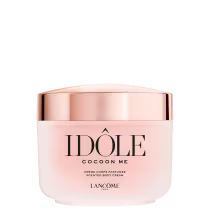 Creme corporal perfumado da linha Idole da Lancôme, em embalagem rosa e dourada com o nome da marca e do produto destacados. O frasco possui formato arredondado e tampa metálica.