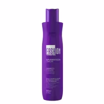 Frasco de shampoo da linha Fashion Gold, na cor roxa, com rótulo destacando o nome "Fashion" e "100 Timetros". O produto é descrito como "Suplementação Capilar" e "Shampoo Antiqueda".
