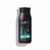 Shampoo Vult, frasco em um design preto liso com o logotipo da marca em destaque. Há informações impressas no rótulo, como "Recarga de Hidratação" e "Colágeno vegetal + Ácido hialurônico", indicando que se trata de um shampoo hidratante.