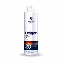 Produto revelador da marca TreeLiss Professional. Embalagem de 1 litro com tampa transparente. Rótulo azul e preto com o logotipo da marca e informações do produto, incluindo "Oxigen Creme Revelador", "Oxidante Estabilizado" e "20 Volumes".