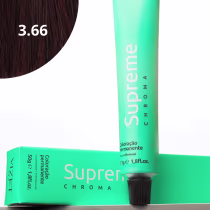 A imagem mostra a embalagem em tubo plástico verde claro com o nome da marca e produto impresso. Caixa retangular verde com detalhes do produto, incluindo a cor e o volume de 50g. No canto superior há uma pequena mecha com o tom da coloração.