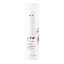 Frasco branco cilíndrico de condicionador Braé Blonde Oil, com rótulo em preto e rosa, contendo 250ml do produto para nutrição regeneradora de cabelos loiros.