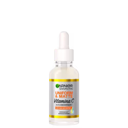 Frasco de soro facial Garnier Skinactive Uniform & Matte com Vitamina C, em embalagem branca e amarela, com conta-gotas e rótulo destacando os benefícios de uniformidade e matificação.