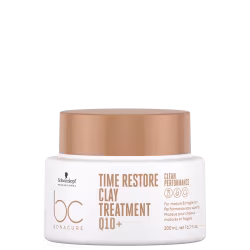 A imagem traz a máscara que vem em um pote branco com tampa bege de 200ml. Na embalagem, está escrito "Time Restore Clay Treatment Q10+" em letras marrons. Também está mencionado "Clean Performance".
