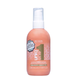 A imagem mostra o Leave-in Curls da linha Uniq One da Revlon Professional. Possui uma embalagem plástica arredondada na cor salmão com tampa branca e detalhes em dourado. Seu rótulo tem informações adicionais como volume e benefícios.