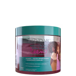 A imagem mostra a Geleia Modeladora e Hidratante Capilar Inoar Meu Cacho, Meu Crush Teen Duomix 500g, embalagem plástica com formato circular. Traz ilustração de meninas com cabelos cacheados. As cores predominantes são verde, rosa e branco.