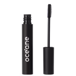 A imagem mostra o Gel Incolor para Sobrancelhas Océane Purple Instant Brows, em um tubo preto cilíndrico com o nome "Océane" impresso em letras brancas e ao lado uma escova aplicadora de cerdas brancas espiraladas.