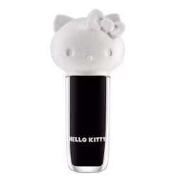 Maquiagem em formato cilíndrico com a cabeça da personagem Hello Kitty como tampa. A parte superior é branca com detalhes em relevo que representam os olhos, orelhas e laço da Hello Kitty. É possível ver a cor do produto pelo corpo transparente.