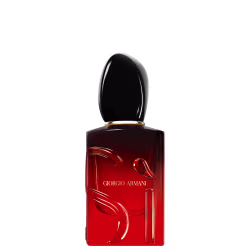 O frasco possui um formato retangular com uma tampa oval, com a marca "Giorgio Armani" impressa em destaque. A cor predominante é o vermelho escuro, com um acabamento brilhante.