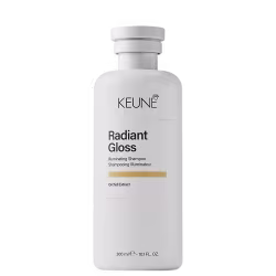 Frasco branco de 300 ml da linha Radiant Gloss da Keune, um shampoo iluminador com extrato de orquídea, com rótulo preto e branco destacando o nome da marca e do produto.