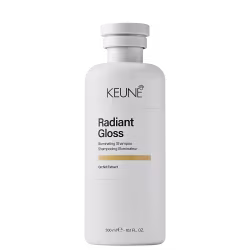 Frasco branco de 300 ml da linha Radiant Gloss da Keune, um xampu iluminador com extrato de orquídea, apresentando rótulo preto com logotipo da marca.