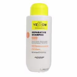 Frasco branco de shampoo reparador da marca Yellow Professional, com rótulo amarelo destacando os ingredientes Bond Complex e Manteiga de Cacau. Produto indicado para fortalecimento dos cabelos.