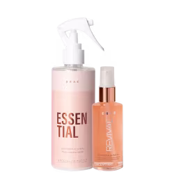 Produtos de cuidado capilar da marca Braé. Um frasco spray branco com a inscrição "Essential" em letras grandes e cor rosa. Ao lado, um frasco menor transparente com líquido alaranjado, com o rótulo "Revival".