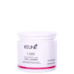 O produto apresentado é um pote branco da marca Keune, contendo uma máscara para cabelos encaracolados chamada "Confident Curl Mask". O pote possui uma tampa branca e contém 200 ml do produto.
