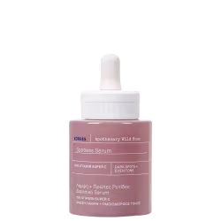 Frasco de soro facial da marca Korres, com rótulo em inglês e grego, contendo 15% de vitamina C, indicado para manchas escuras e uniformidade do tom da pele. Embalagem de vidro com conta-gotas branco.