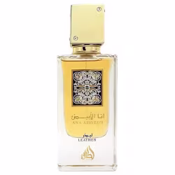 Frasco de perfume dourado com detalhes em preto e branco, contendo a marca "Ana Abiyedh" e a descrição "Leather" em inglês. O produto faz parte da linha de perfumes Lattafa.