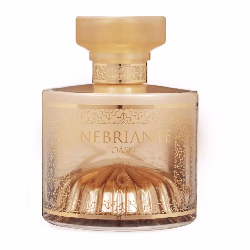 Frasco de perfume Inebriant Oásis da Hinode, com design elegante e detalhes dourados em sua embalagem. O produto apresenta um formato arredondado e uma tampa decorativa, transmitindo uma imagem de sofisticação e exclusividade.