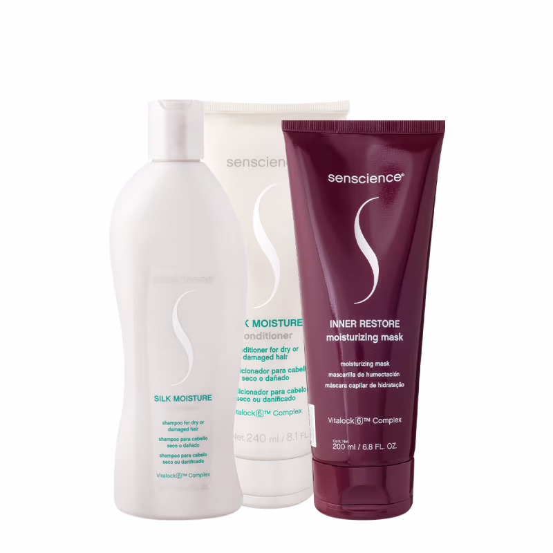 Produtos Senscience: Condicionador Silk Moisture, Shampoo Silk Moisture e Máscara Inner Restore em embalagens brancas e vermelhas, com rótulos indicando os nomes e propriedades dos produtos.