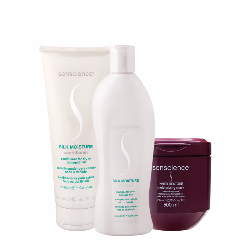 Produtos Senscience: Condicionador Silk Moisture, Shampoo Silk Moisture e Máscara Inner Restore em embalagens brancas e vermelhas, com rótulos indicando os nomes e propriedades dos produtos.