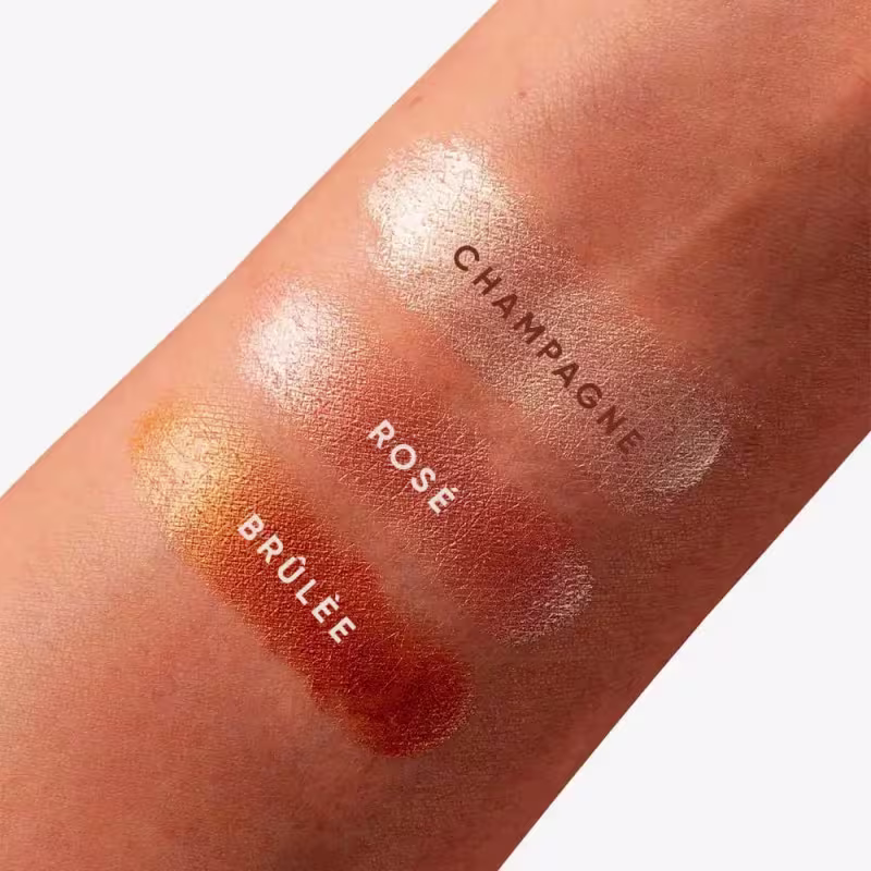 A imagem apresenta amostra das cores Brûlée, "Champagne" e "Rose" em pele morena