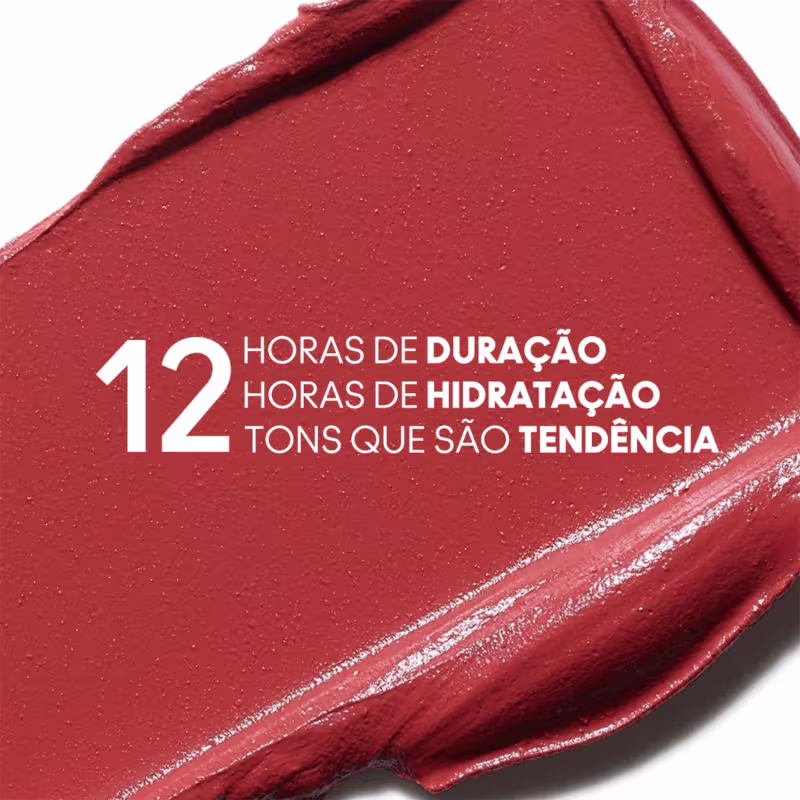 A imagem mostra um pouco do produto espalhado em um fundo branco com informações escrito em branco, em cima do produto, sobre as 12 horas de duração, hidratação e 12 tons da coleção.