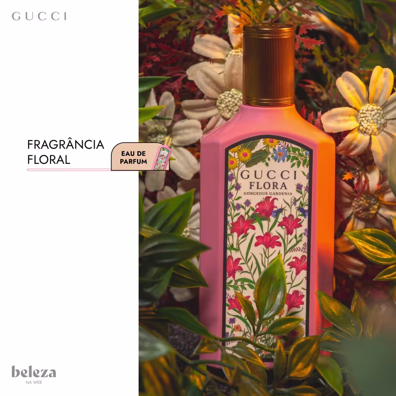 Frasco de item de perfumaria da marca Gucci com rótulo ilustrado com flores e folhagens coloridas em fundo rosa.