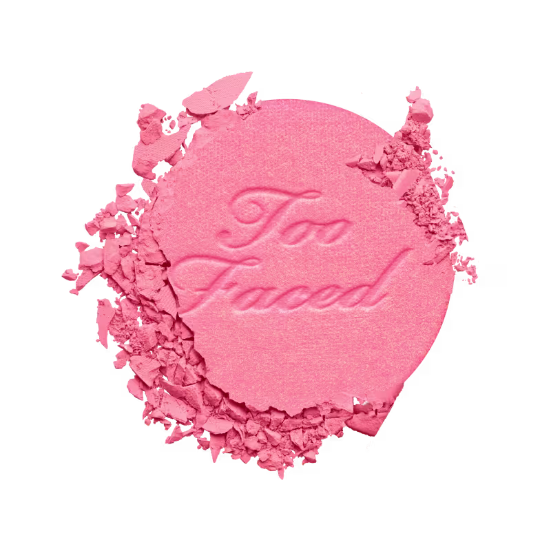 A imagem mostra apenas o conteúdo em pó fora da embalagem, levemente amassado mostrando a textura fina.