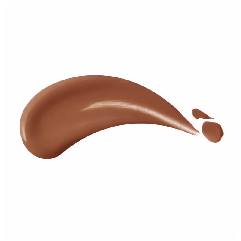 Amostra de base facial em uma superfície branca. Na foto, é possível identificar a textura do produto, que é cremosa e viçosa.