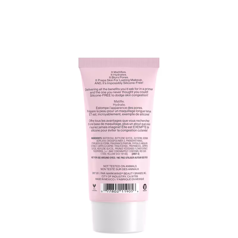 A imagem mostra um tubo rosa de um produto da marca Wet n Wild. No rótulo, o texto afirma que o produto não foi testado em animais e é feito no México. Na parte inferior, há informações adicionais sobre os ingredientes e o código de barras do item.