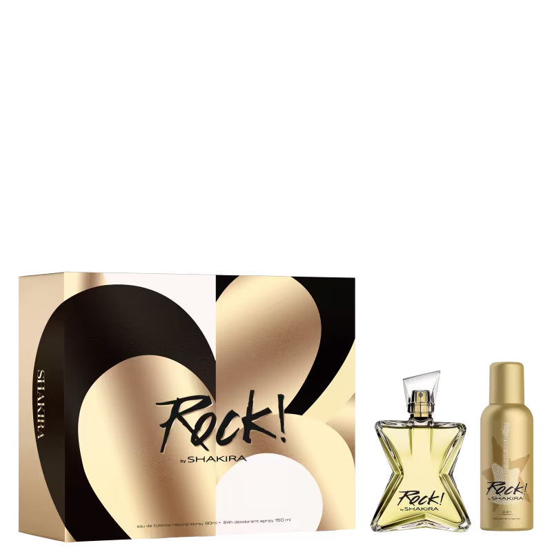 Conjunto de produtos de perfumaria da marca Shakira. Inclui um frasco de perfume em formato triangular com líquido dourado, uma caixa preta e dourada com o nome "Rock!" em letras cursivas, e um frasco menor de desodorante spray na mesma tonalidade dourada