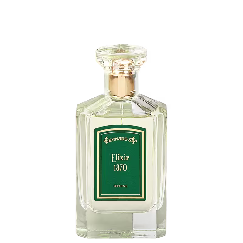 A imagem mostra o perfume em frasco retangular de vidro transparente com tampa dourada. A embalagem apresenta um rótulo verde com a inscrição "Granado & Elixir 1870 Perfume" em letras beges. O frasco tem linhas retas e cantos angulares.