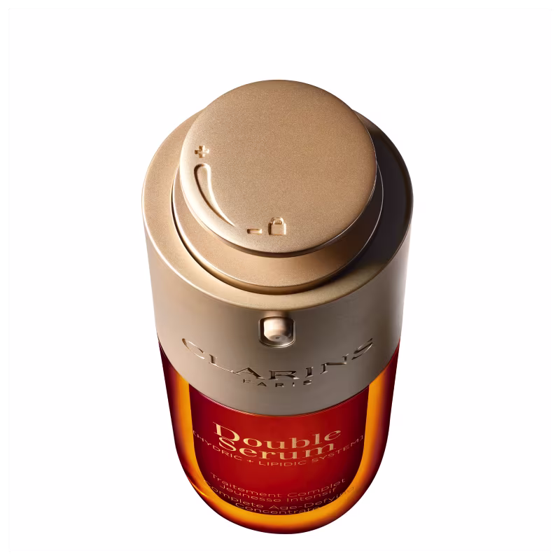 A imagem mostra um frasco de sérum marrom com uma tampa em pump cromada.