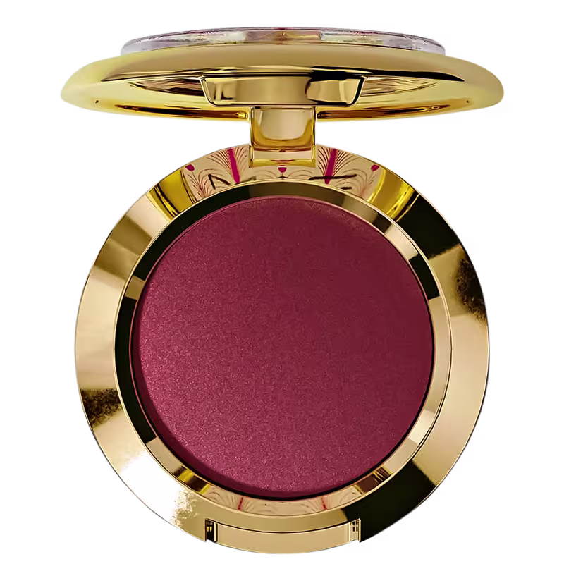 A imagem mostra uma embalagem redonda, dourada, com blush cor vermelha.