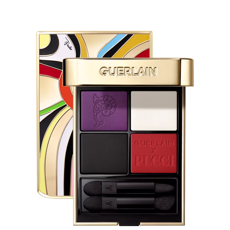 Caixa dourada com design gráfico colorido contendo paleta de sombras Guerlain x Pucci em tons de roxo, preto e laranja, com pincéis aplicadores.