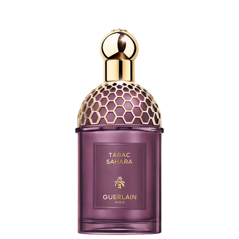 Frasco de perfume Guerlain Tabac Sahara, com design elegante e geométrico em tons de roxo e dourado, destacando o nome da fragrância e a marca.