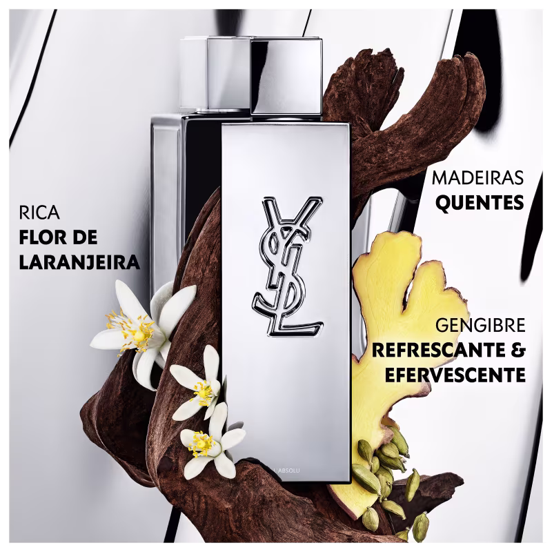 Frasco de perfume de design minimalista prateado, com o logotipo da marca Yves Saint Laurent em destaque. A embalagem possui uma forma geométrica simples e elegante, com uma tampa destacada no topo.
