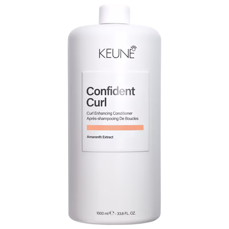 Frasco branco da linha Confident Curl da Keune, um condicionador para realçar cachos, com rótulo destacando o nome do produto e ingrediente principal, o extrato de amaranto.