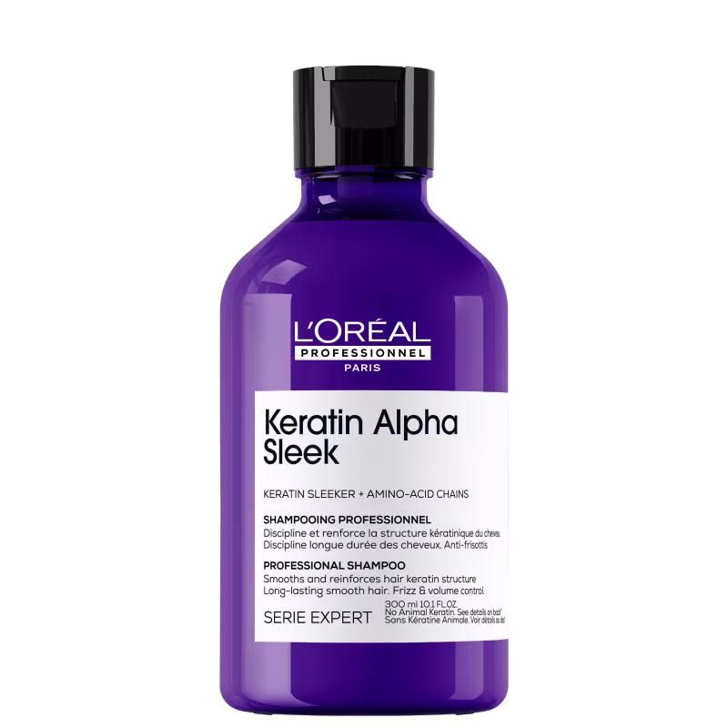 Frasco de shampoo profissional da marca L'Oréal Professionnel, com design em tons de roxo e preto, rotulado como "Keratin Alpha Sleek" com informações sobre seus benefícios para cabelos.