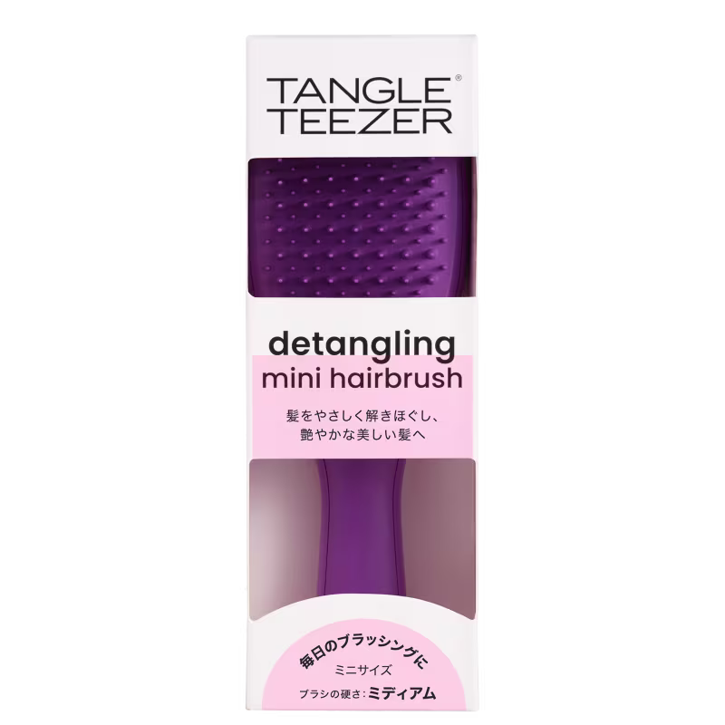 Tangle Teezer detangling mini hairbrush em embalagem roxa e rosa.